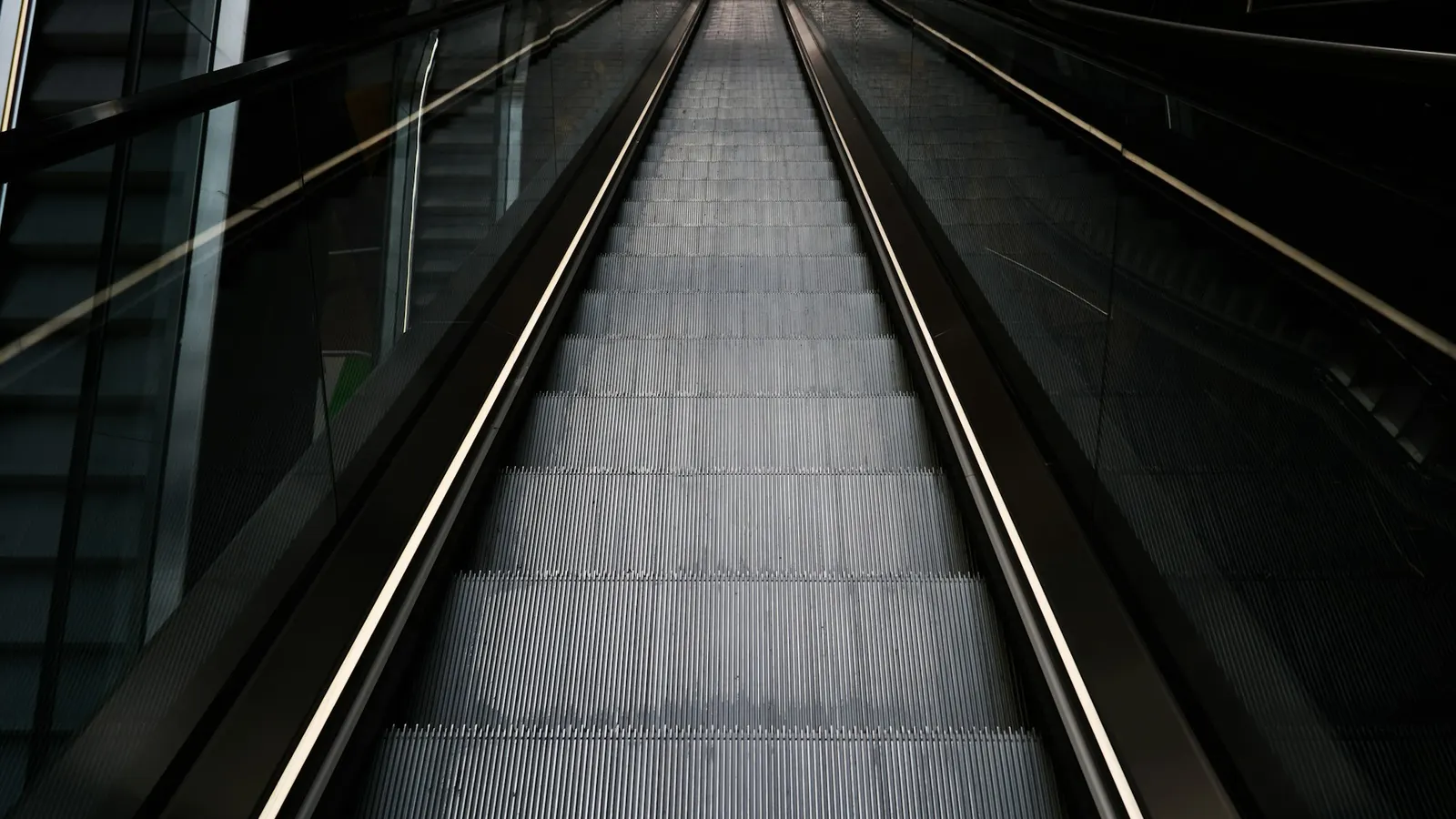 Parallel lines and handrails of an escalator